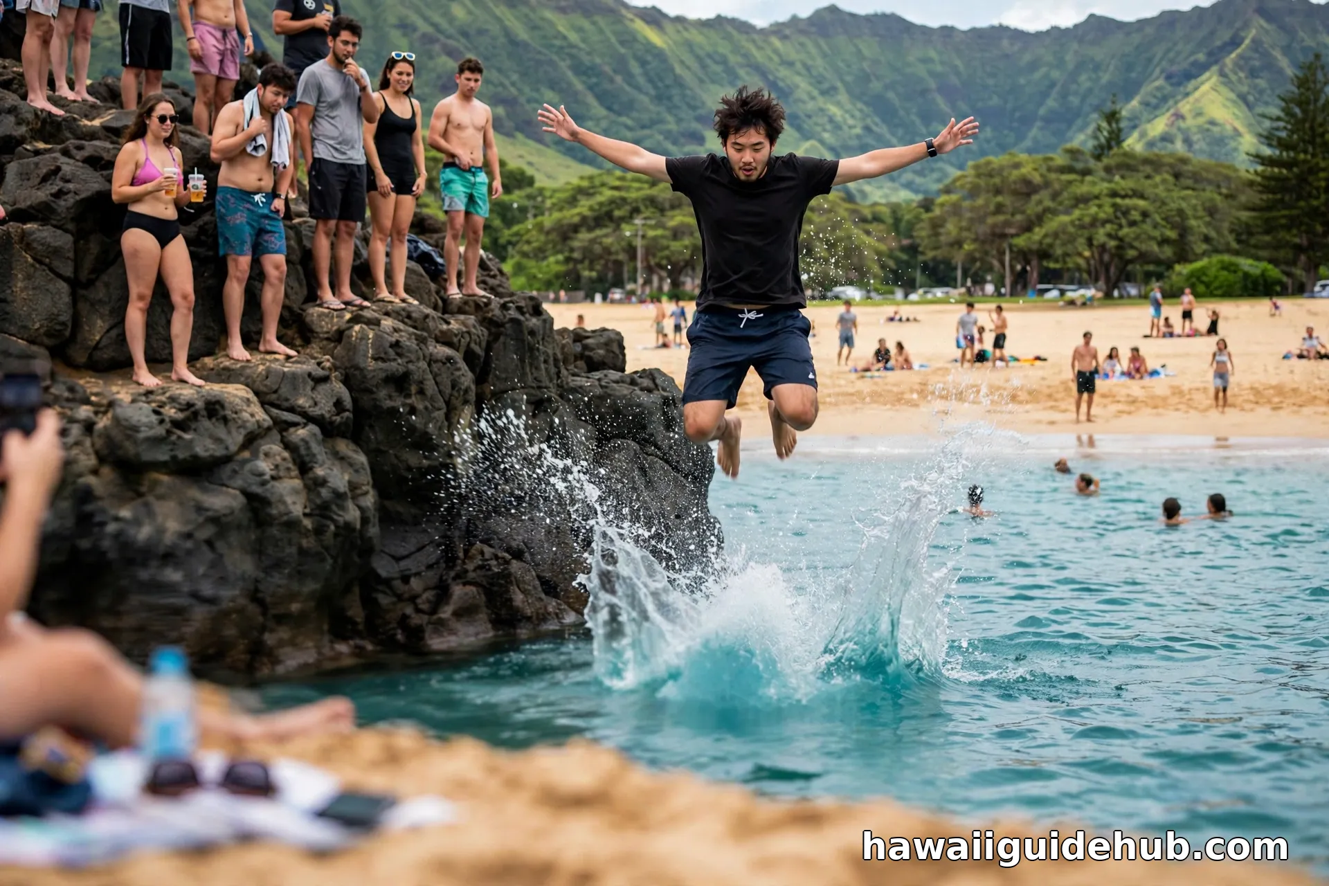 Young man jumping off the Waimea Bay rock into the turquoise ocean