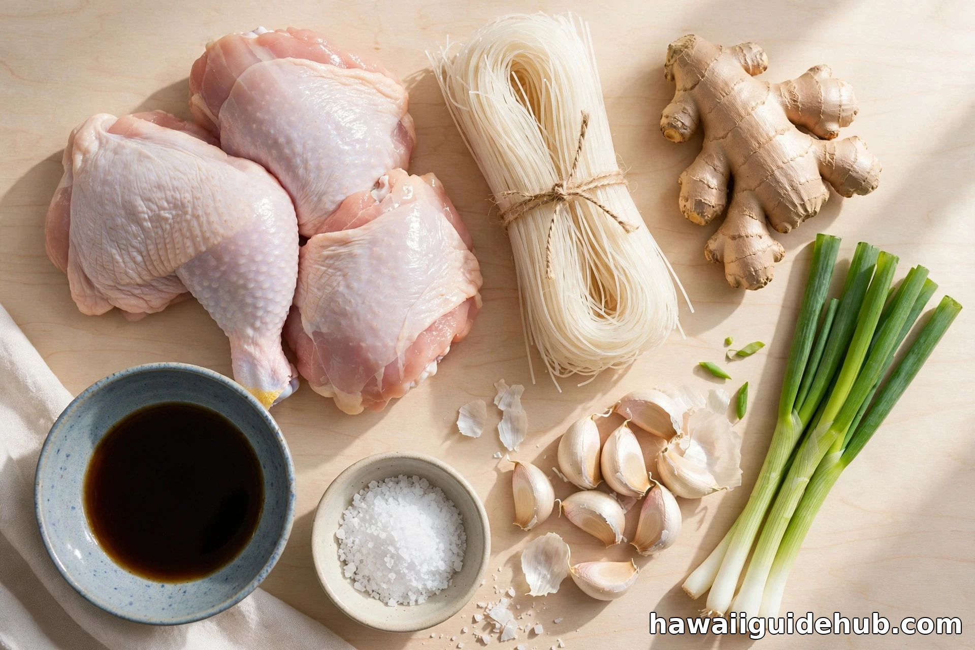 Ingredients for chicken long rice: chicken thighs, dried bean thread noodles, fresh ginger, garlic, green onions, shoyu, and sea salt