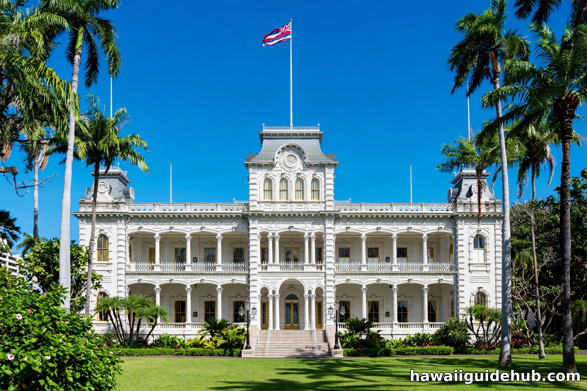 Iolani Palace royal palace in downtown Honolulu with palm trees and blue sky