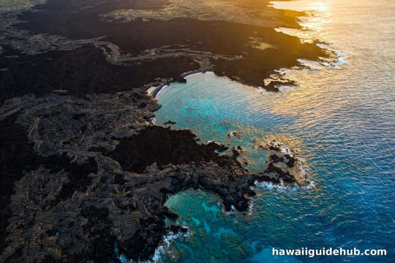 Aerial view of La Perouse Bay on Maui at golden hour with black lava fields meeting turquoise ocean