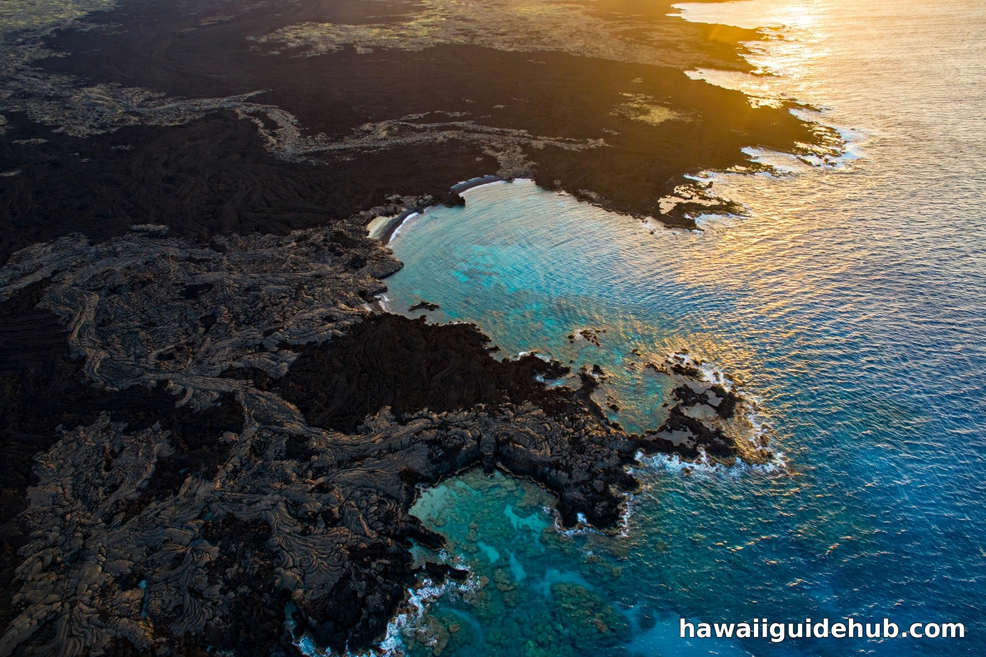 Aerial view of La Perouse Bay on Maui at golden hour with black lava fields meeting turquoise ocean