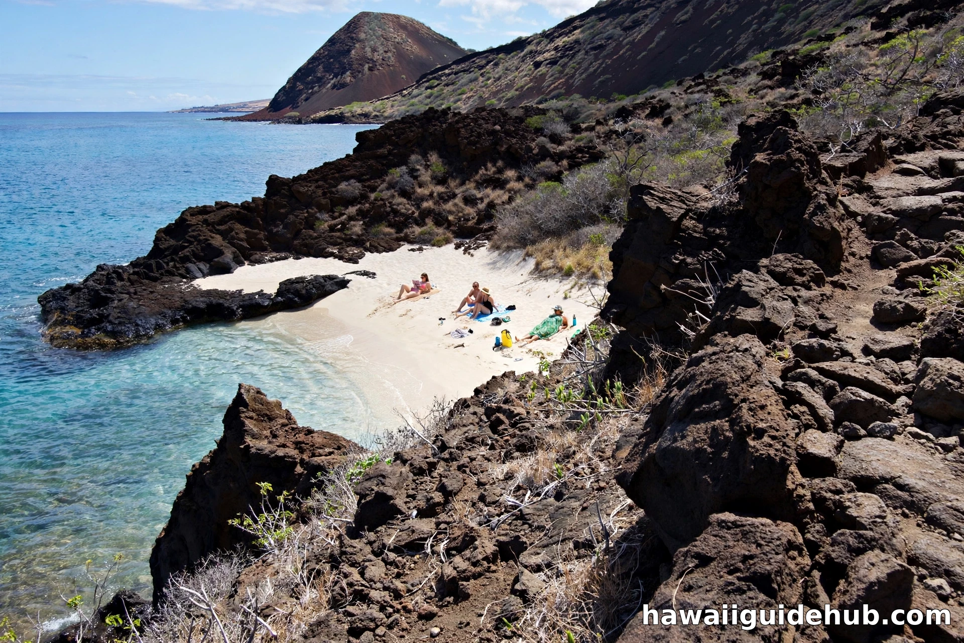 View down the lava rock trail to Little Beach, a small white sand cove tucked between volcanic rock near Big Beach Maui