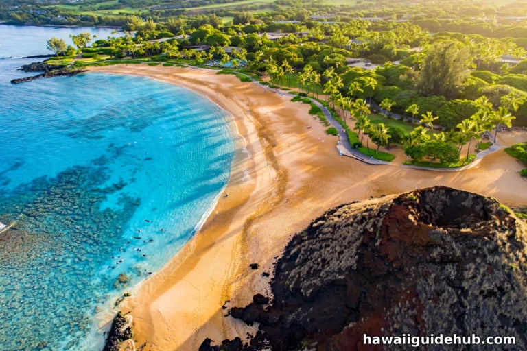 Aerial view of Maluaka Beach on Maui at golden hour with Puu Olai cinder cone
