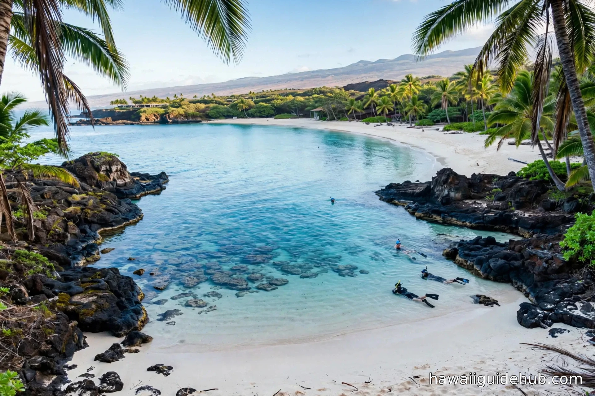 The crescent-shaped white sand of Kaunaʻoa Bay at Mauna Kea Beach on the Kohala Coast