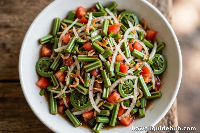 Close-up of Hawaiian pohole salad with fern shoots, tomatoes, onions, and dried shrimp in a white bowl