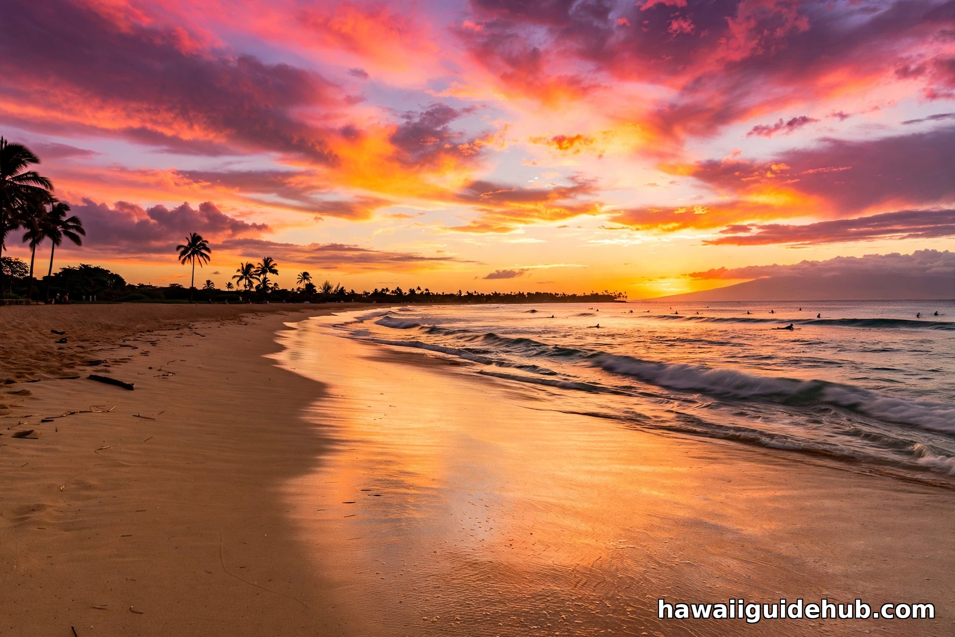 Sunset over Sunset Beach on Oahu's North Shore with golden sand and surfers in the water